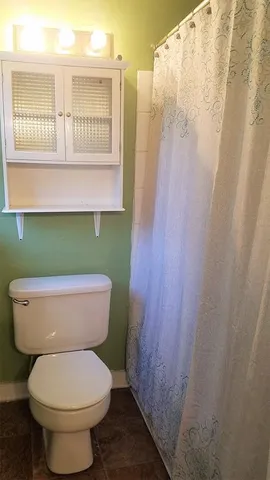a bathroom with a toilet and a sink