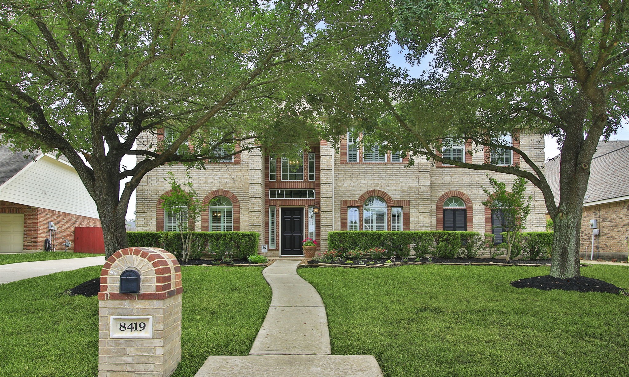 8419 Marchelle Lane Spring, TX 77379 - Photo 3 of 42 a front view of a house with garden