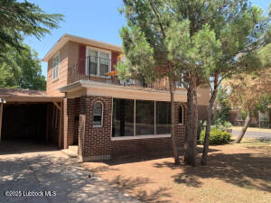 2629 22nd Street Lubbock, TX 79410 - Photo 1 of 1 a front view of a house with a garden