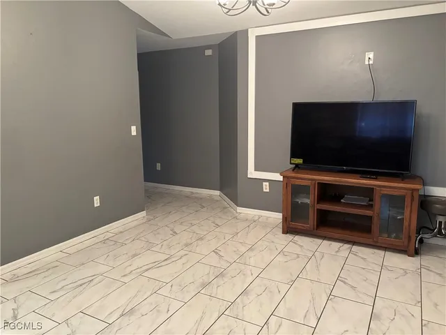 a kitchen with cabinets and stainless steel appliances
