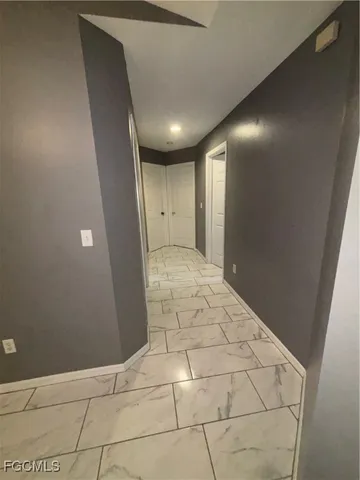 a bathroom with a sink vanity and mirror
