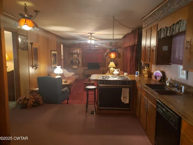 a kitchen with stove and cabinets