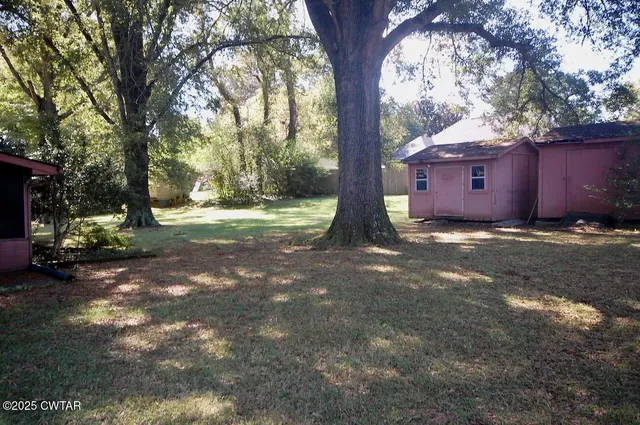 a backyard of a house with lots of green space