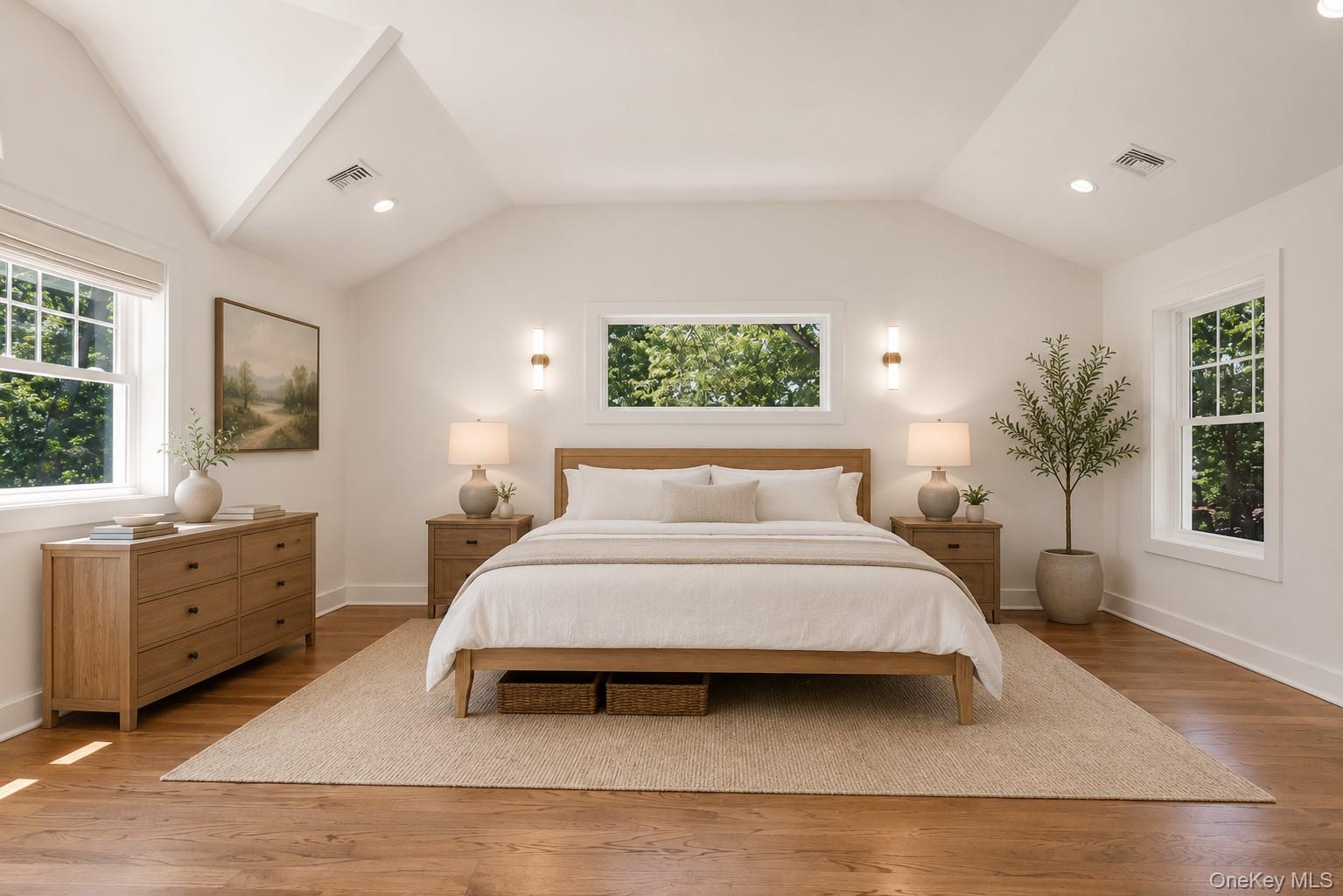 597 Pulaski Road Kings Park, NY 11754 - Photo 7 of 26 Primary Bedroom Suite with high ceilings, WIC and hardwood floors. 3 exposures