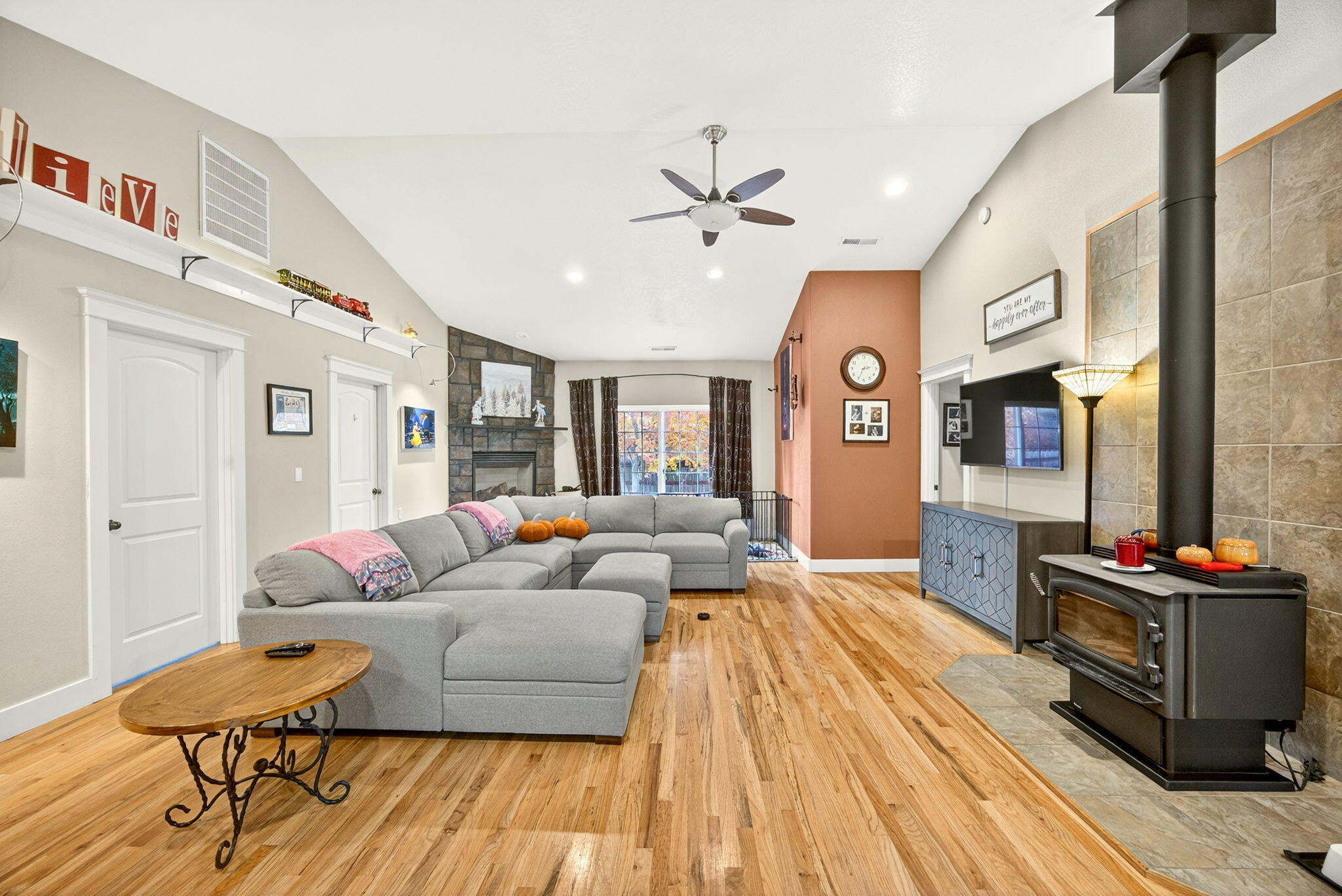16 Portabello Way Eagle Point, OR 97524 - Photo 11 of 43 a living room with fireplace furniture and a flat screen tv