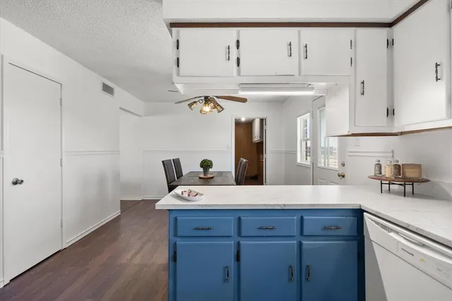 a kitchen with a sink a refrigerator and a stove