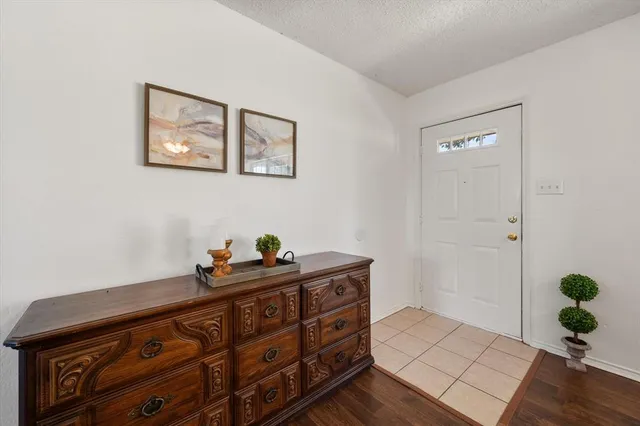 a bed room with a bed and a potted plant