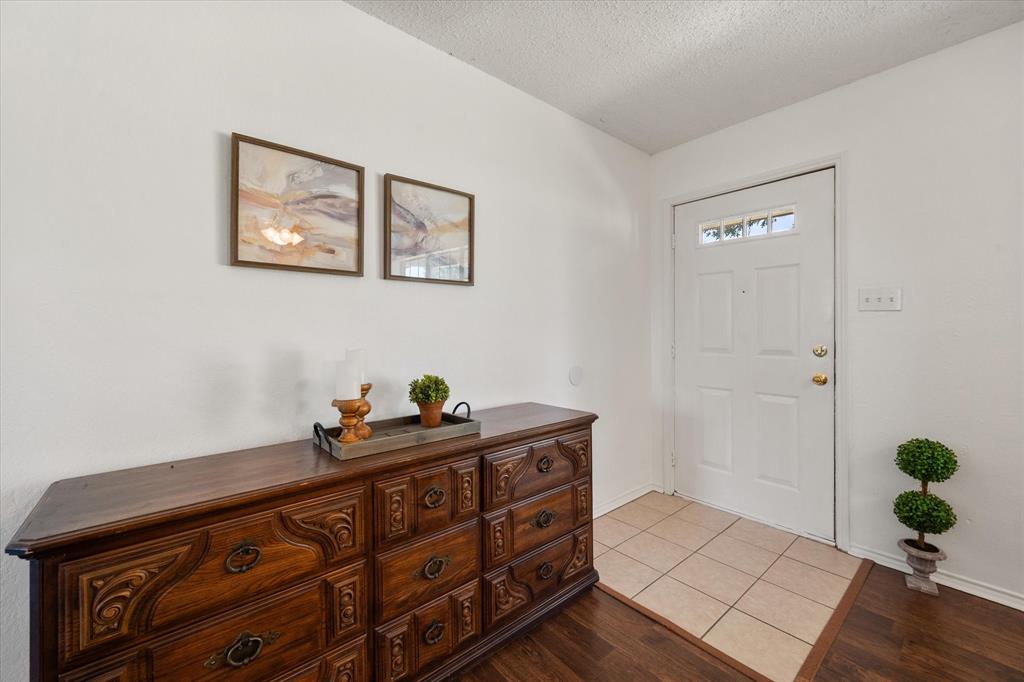 2038 Forreston Road Waxahachie, TX 75165 - Photo 6 of 39 Foyer with a textured ceiling and wood finished floors