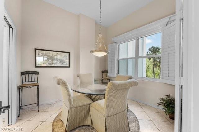 6573 Marissa Loop, Unit 105 Naples, FL 34108 - Photo 13 of 42 a dining room with furniture and window