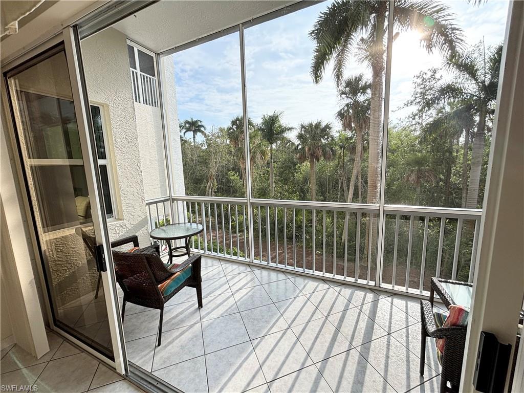 6573 Marissa Loop, Unit 105 Naples, FL 34108 - Photo 26 of 42 a view of balcony with furniture