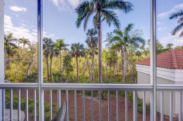 6573 Marissa Loop, Unit 105 Naples, FL 34108 - Photo 28 of 42 a view of a yard with palm trees