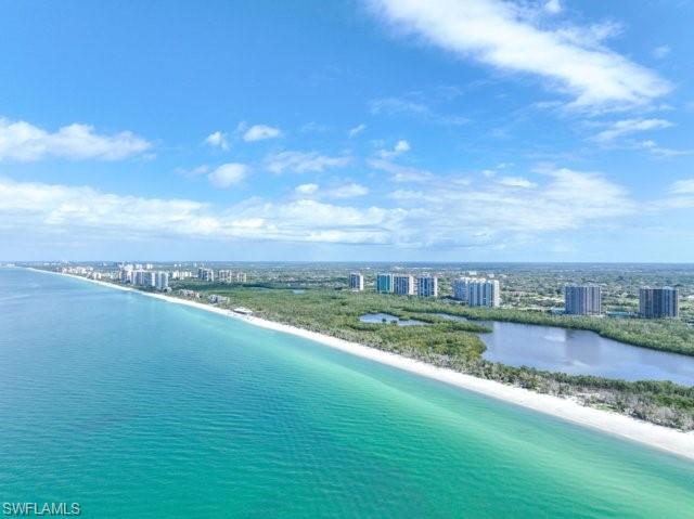 6573 Marissa Loop, Unit 105 Naples, FL 34108 - Photo 37 of 42 a view of a lake with a big yard