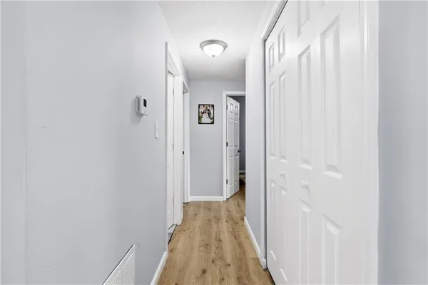 a view of a bathroom from a hallway