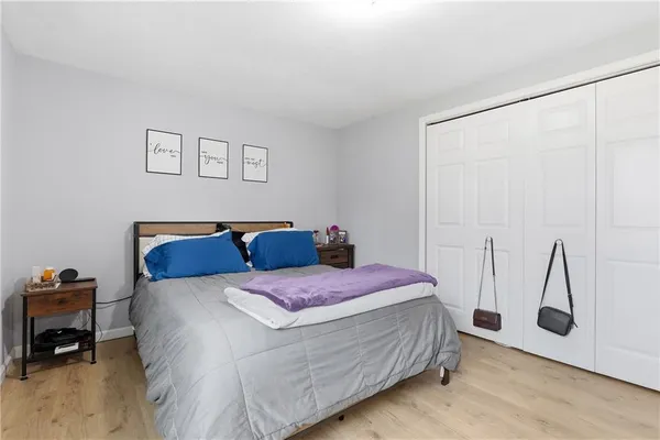 a bedroom with a bed and a table in it