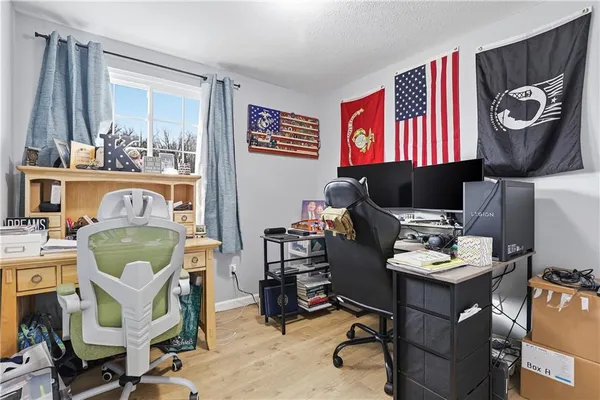 a work room with furniture and a window