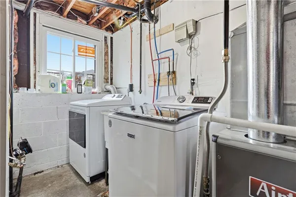 a bathroom with a double vanity sink mirror and