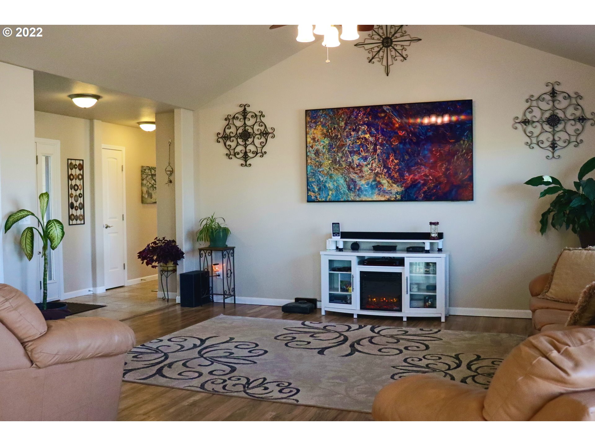 705 L Loop Baker City, OR 97814 - Photo 8 of 32 a living room with furniture a couch and a fireplace