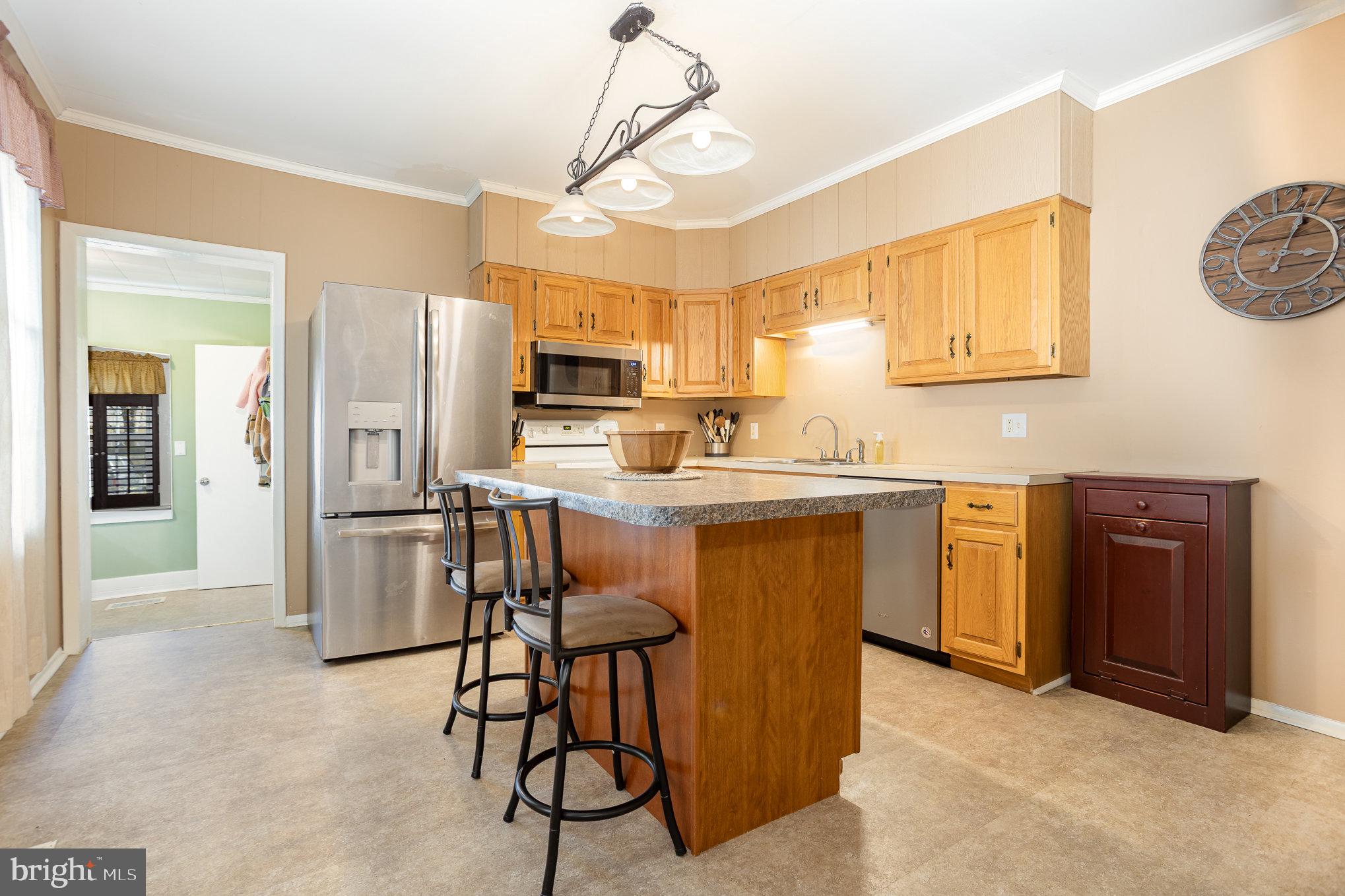 21 West Gramby Street Manheim, PA 17545 - Photo 11 of 36 a kitchen with a refrigerator a sink and dishwasher