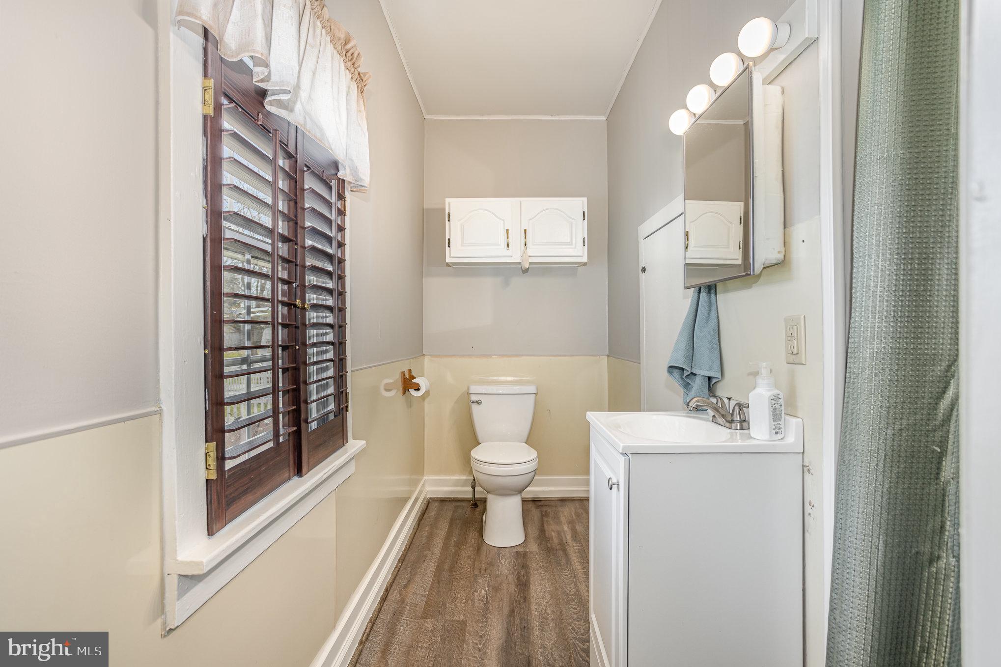21 West Gramby Street Manheim, PA 17545 - Photo 15 of 36 a bathroom with a toilet a sink and a mirror