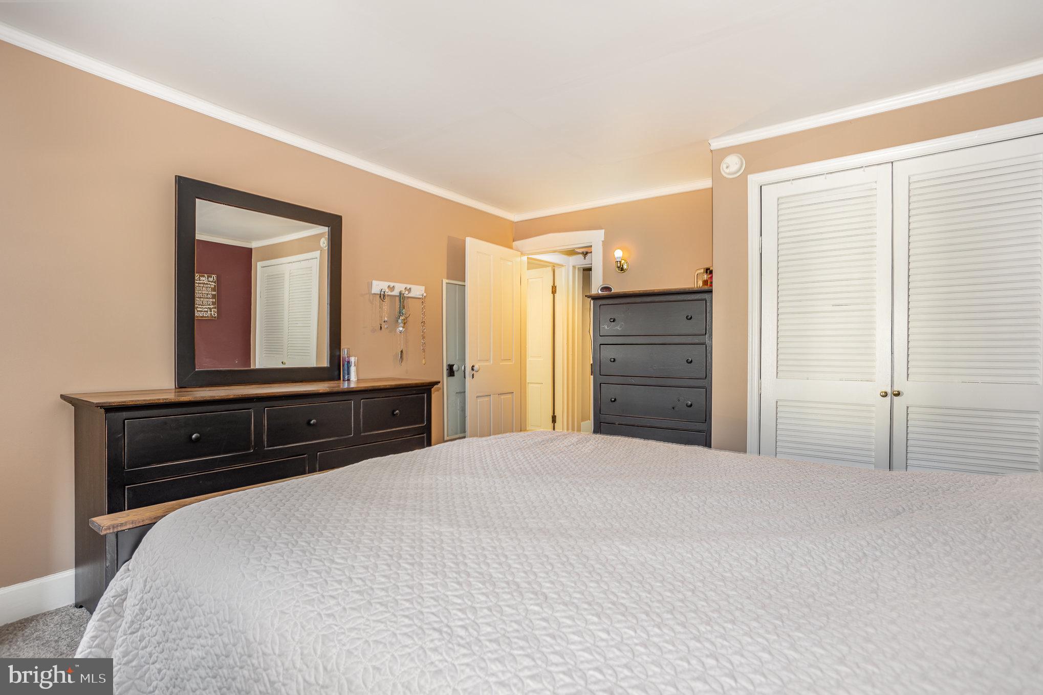21 West Gramby Street Manheim, PA 17545 - Photo 17 of 36 a bedroom with a bed and a large mirror