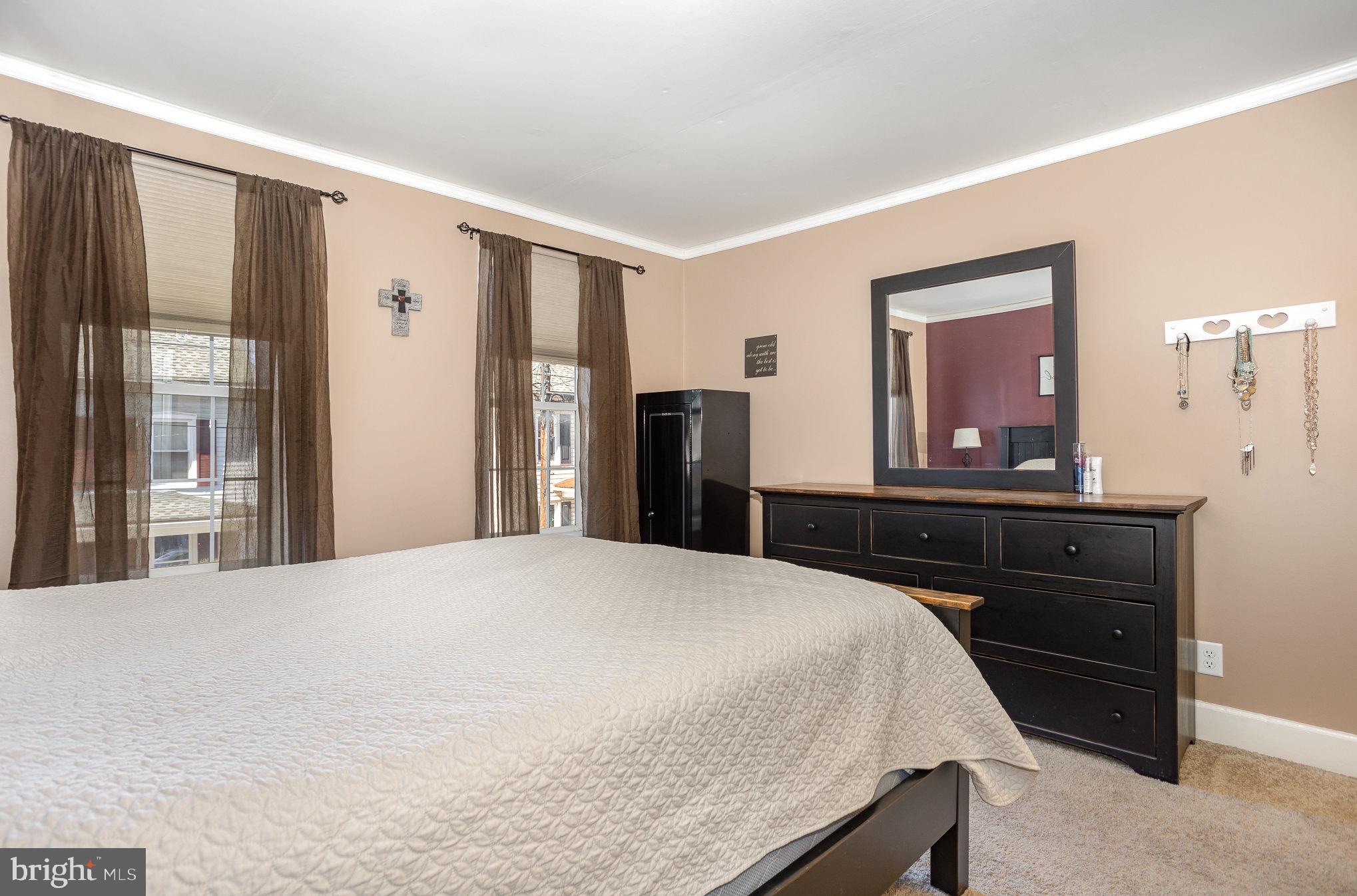 21 West Gramby Street Manheim, PA 17545 - Photo 18 of 36 a bedroom with a bed and a large mirror on the dresser
