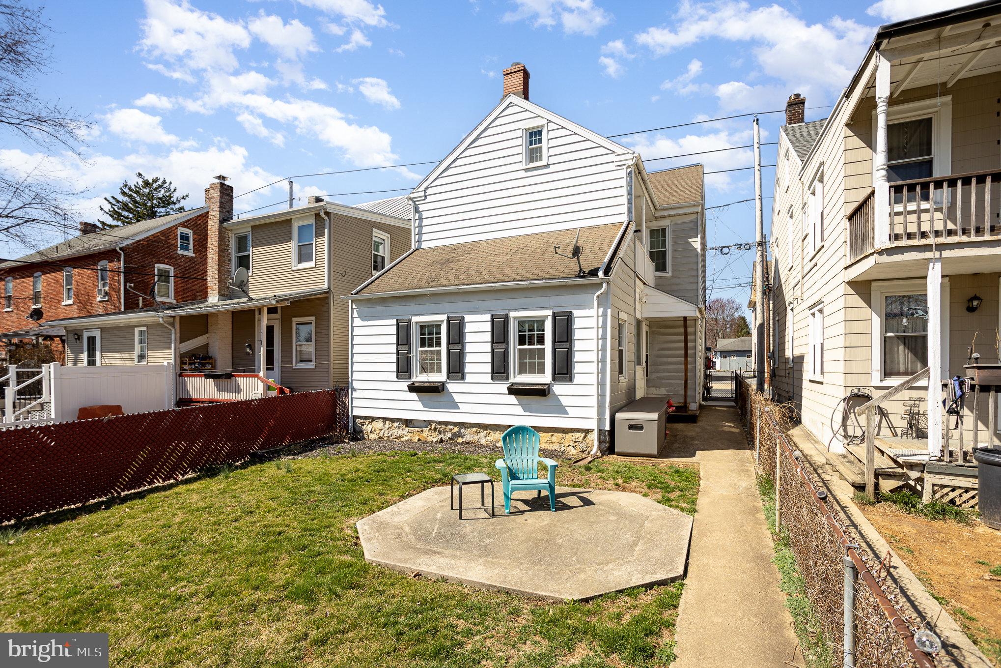 21 West Gramby Street Manheim, PA 17545 - Photo 27 of 36 a front view of a house with a yard outdoor seating and barbeque oven
