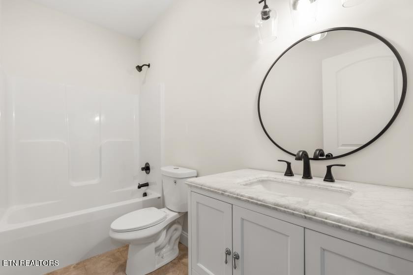 1937 River Poppy Road Mascot, TN 37806 - Photo 8 of 26 a bathroom with a sink a toilet and a mirror