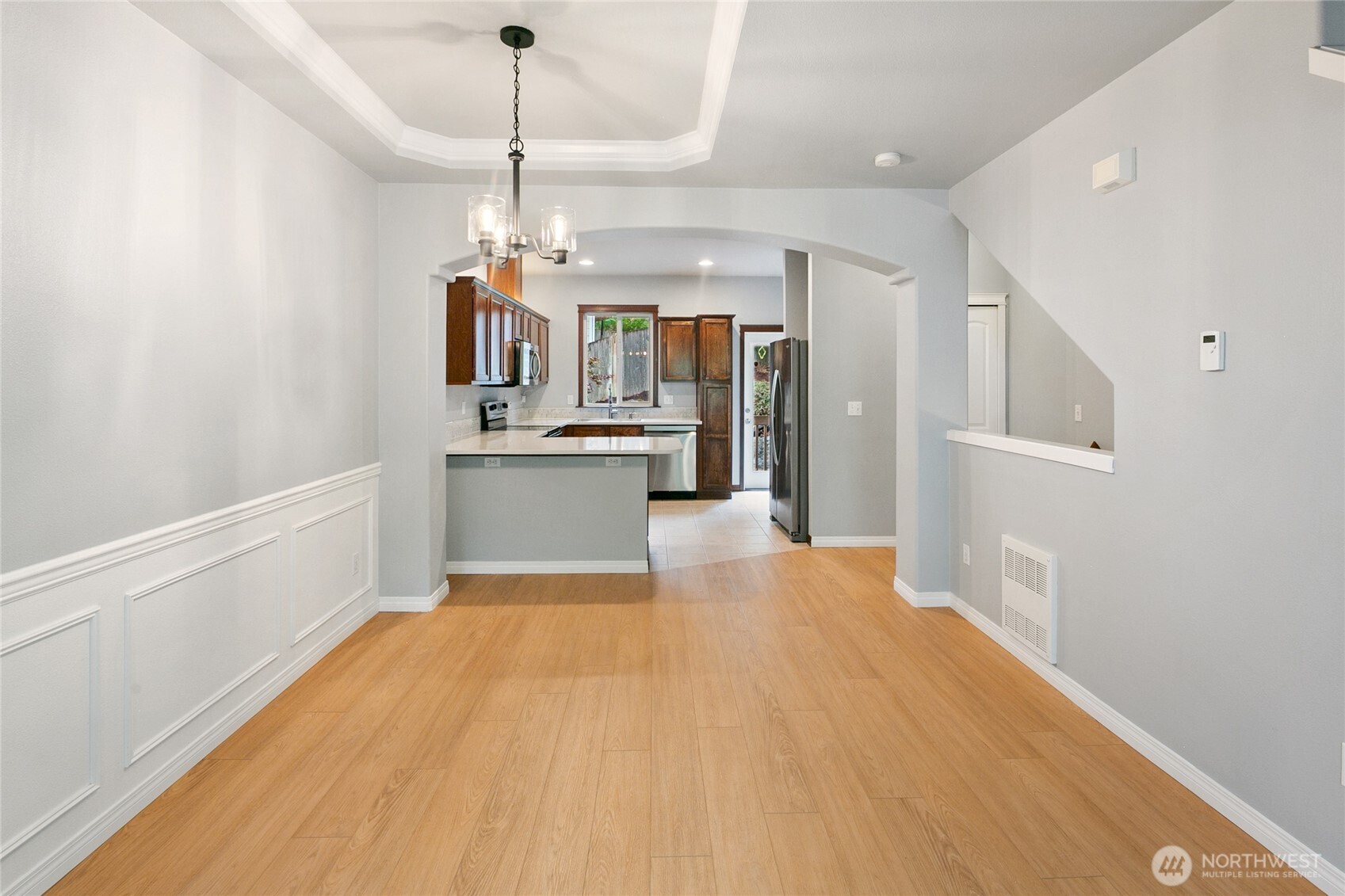 2923 Belmonte Lane Everett, WA 98201 - Photo 11 of 33 a view of a kitchen with a sink wooden floor and windows