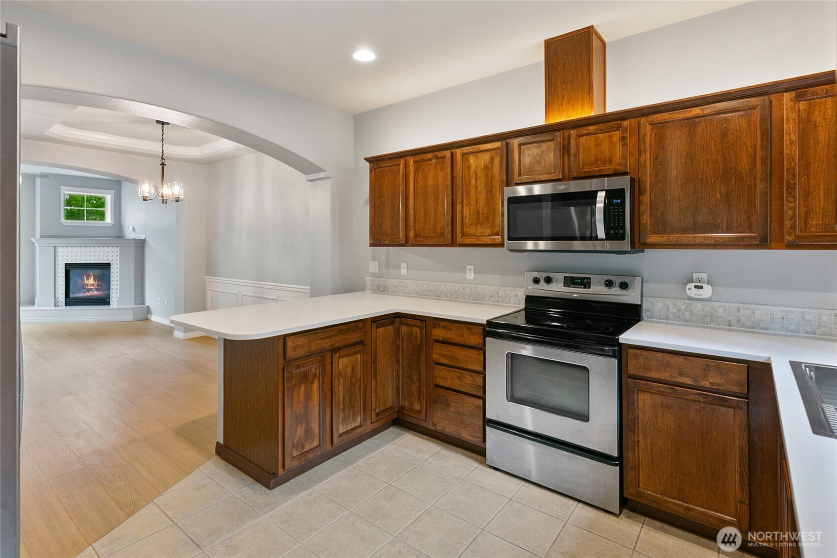 2923 Belmonte Lane Everett, WA 98201 - Photo 15 of 33 a kitchen with stainless steel appliances granite countertop a stove microwave and sink