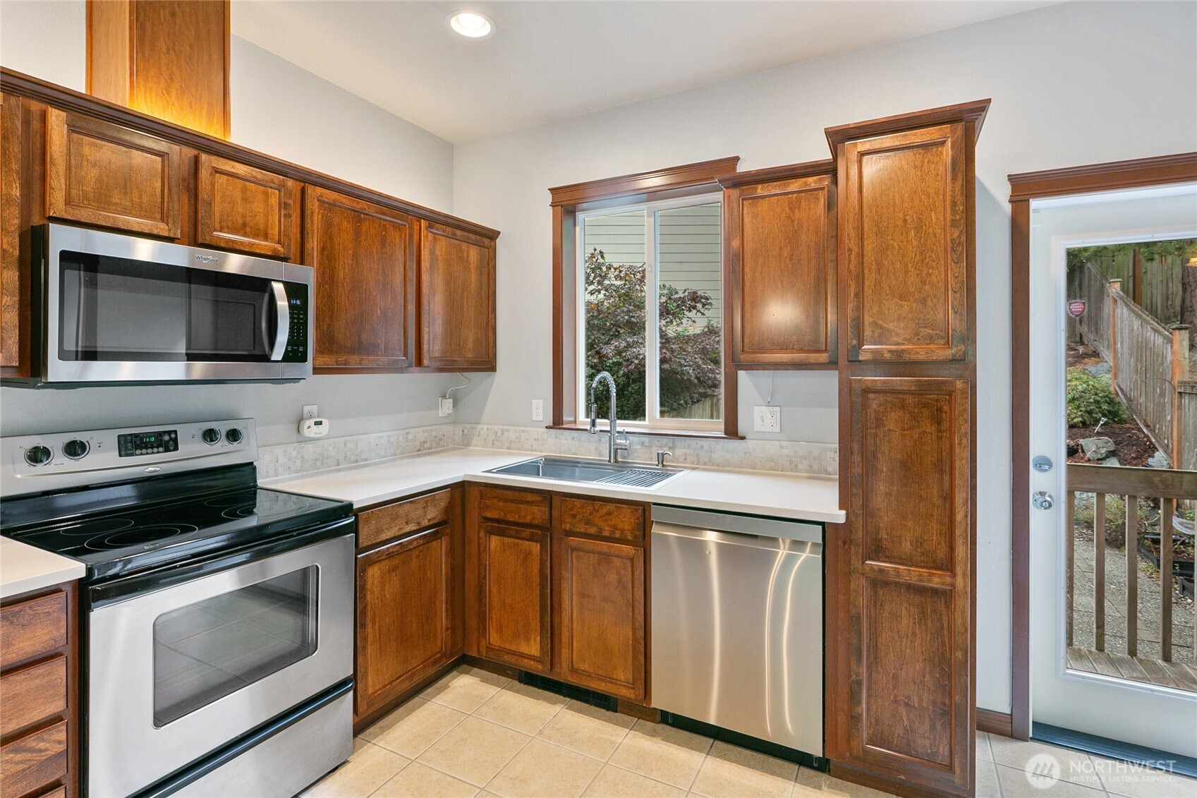 2923 Belmonte Lane Everett, WA 98201 - Photo 16 of 33 a kitchen with a sink stove and microwave