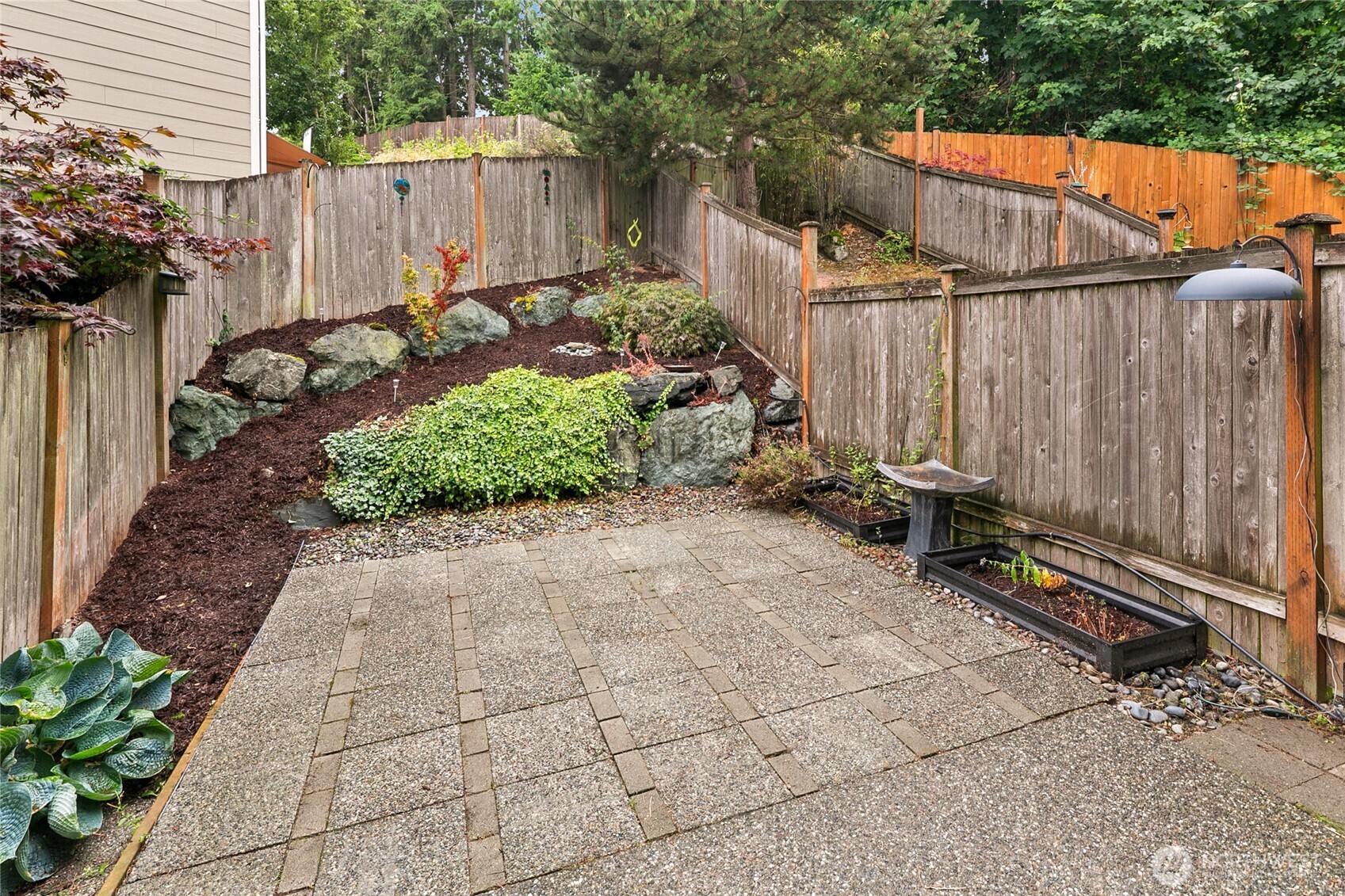 2923 Belmonte Lane Everett, WA 98201 - Photo 30 of 33 a view of a backyard with a wooden fence