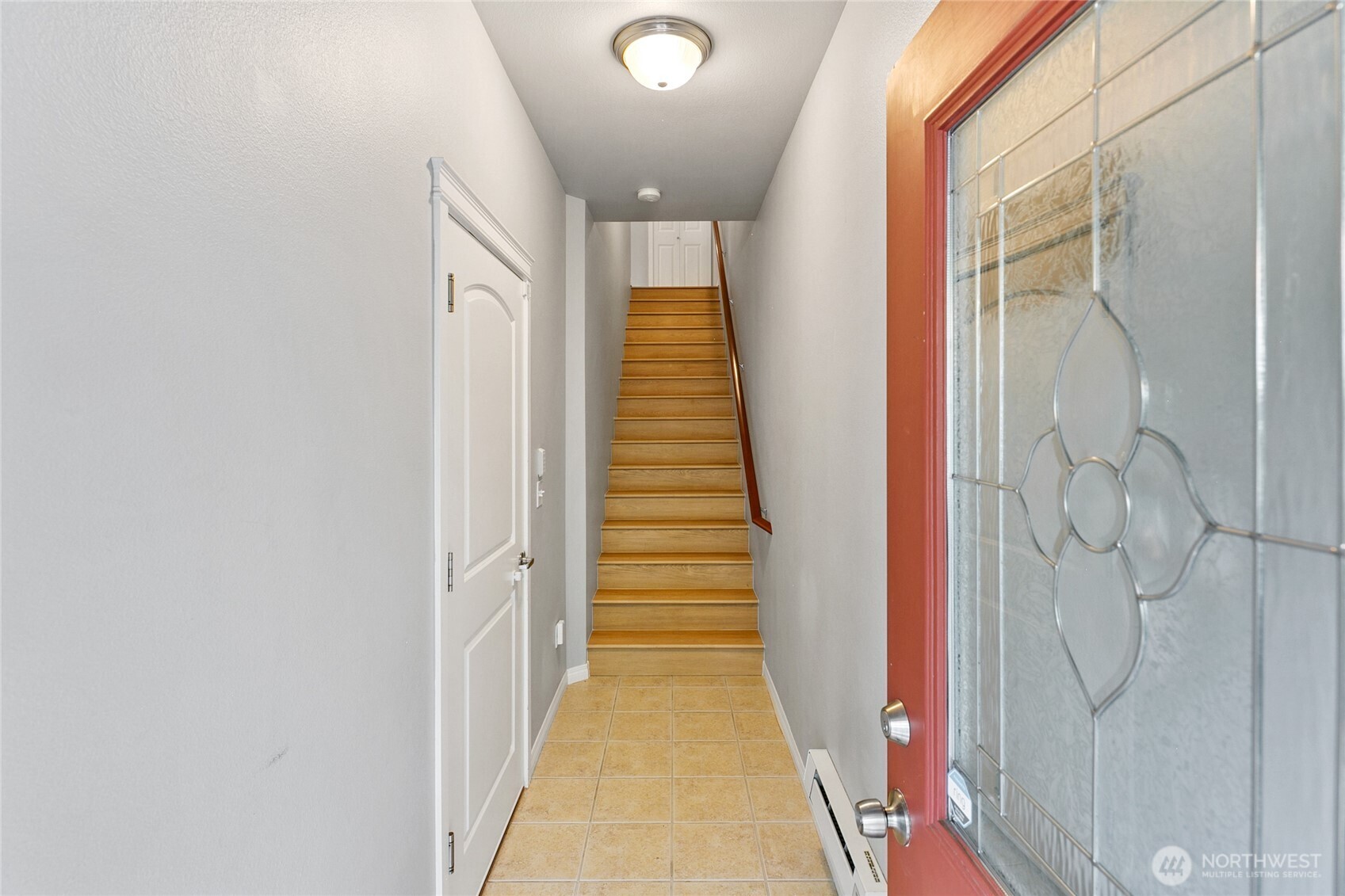 2923 Belmonte Lane Everett, WA 98201 - Photo 4 of 33 a view of a hallway with wooden floor and stairs