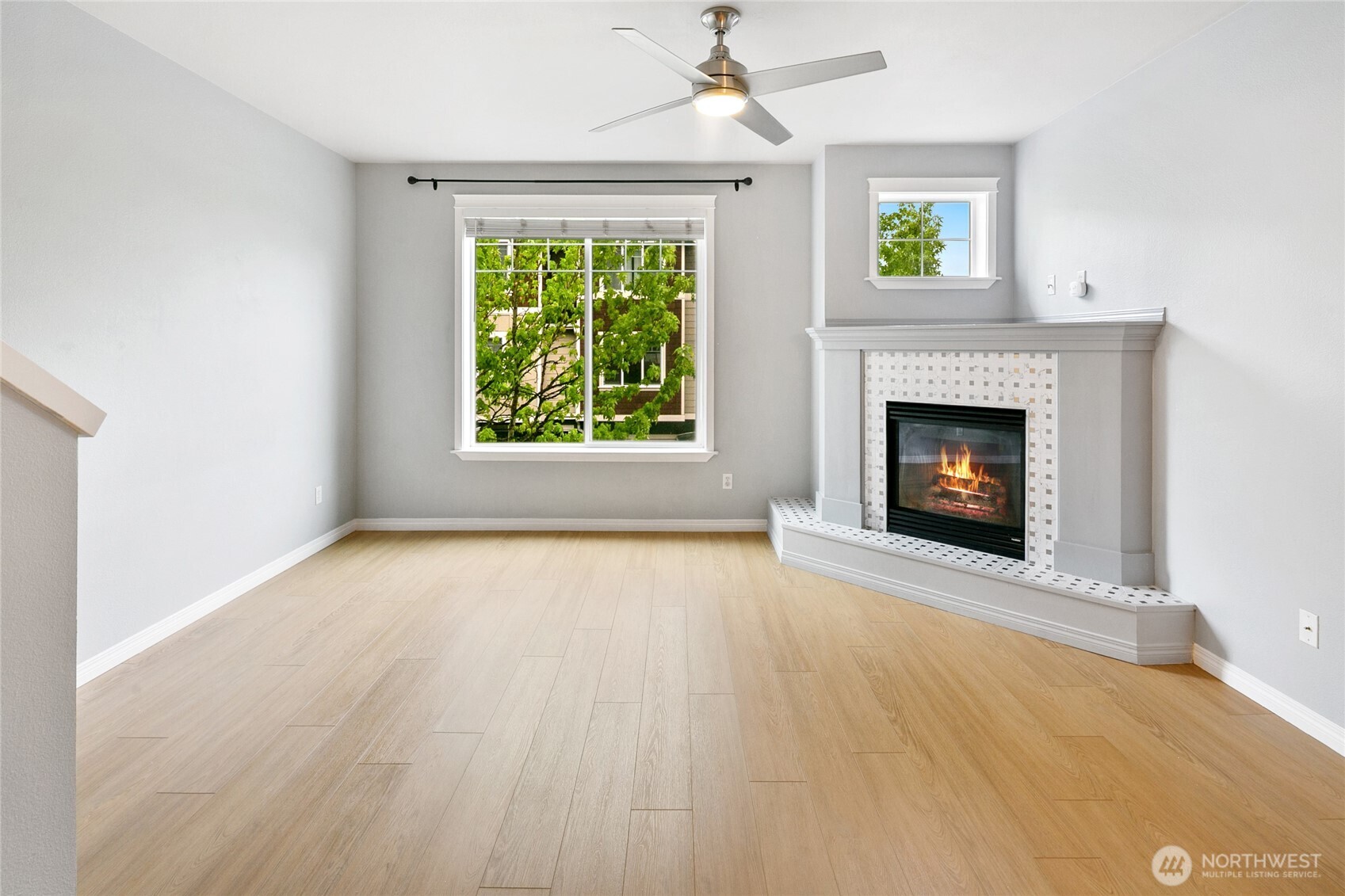 2923 Belmonte Lane Everett, WA 98201 - Photo 7 of 33 an empty room with windows and fireplace