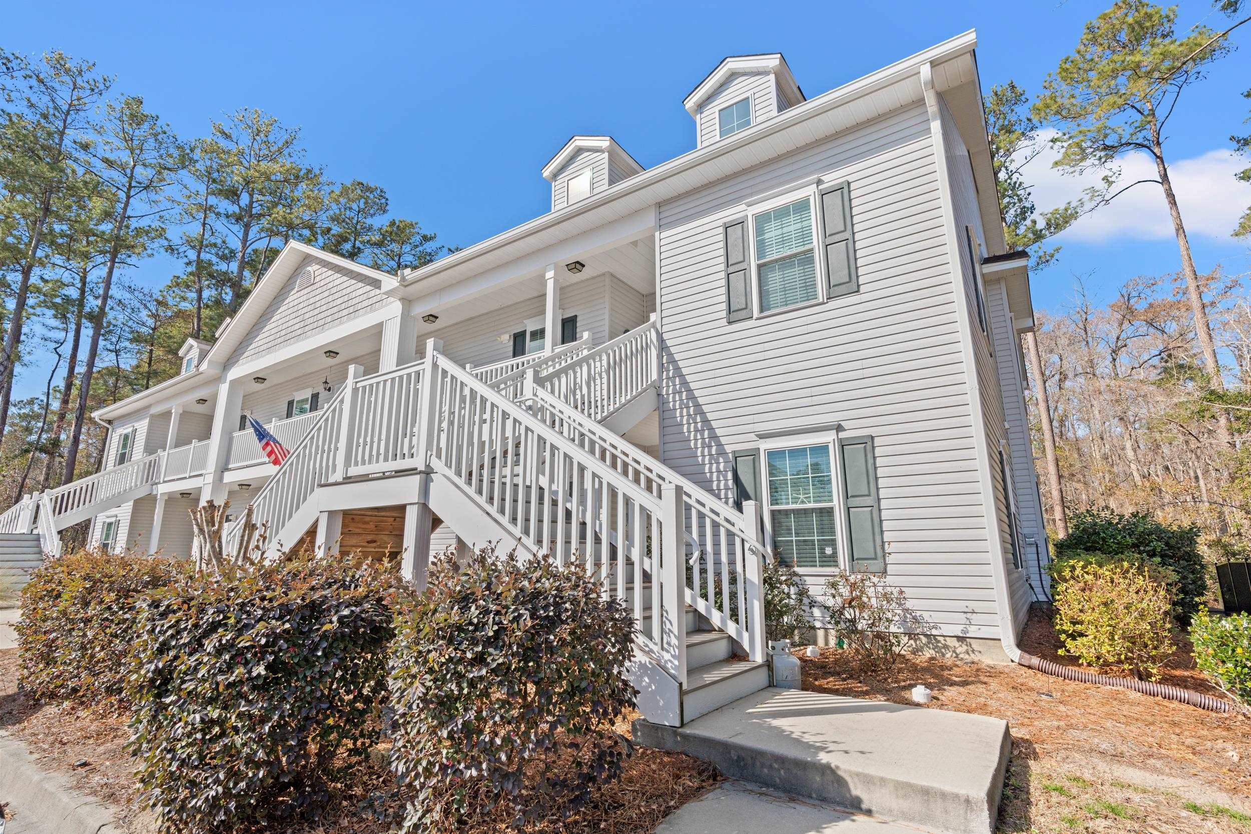 900 Jackline Place, Unit 202 Murrells Inlet, SC 29576 - Photo 13 of 39 View of front of home featuring stairway and covered porch