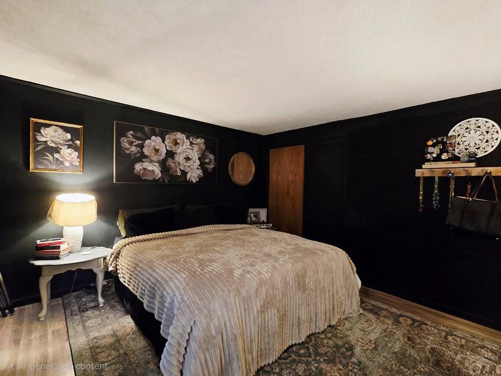 205 3rd Street Swink, CO 81077 - Photo 5 of 26 a bedroom with a bed and a table in it