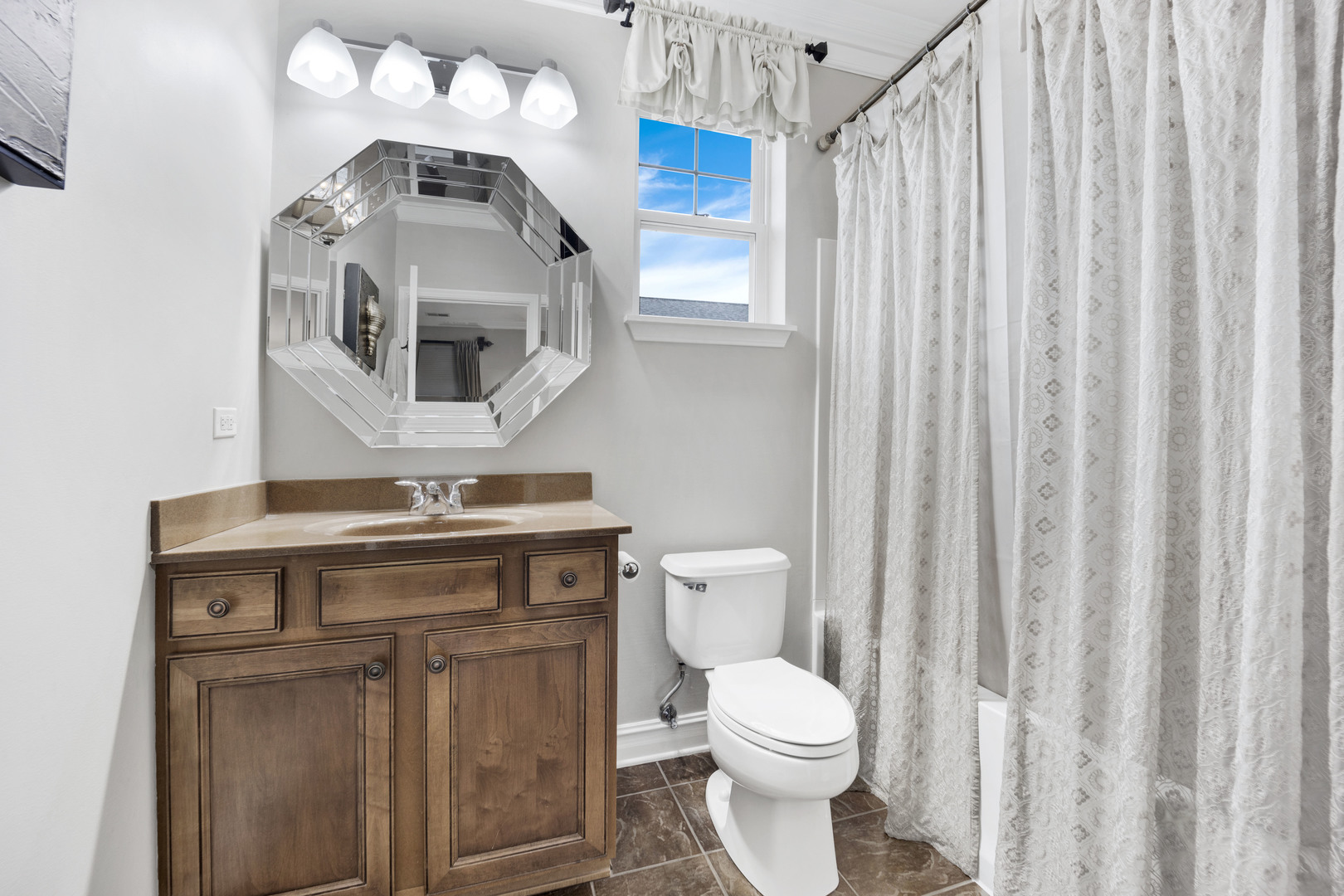1914 Havenshire Road, Unit 1914 Aurora, IL 60502 - Photo 15 of 31 a bathroom with a toilet a sink and a mirror