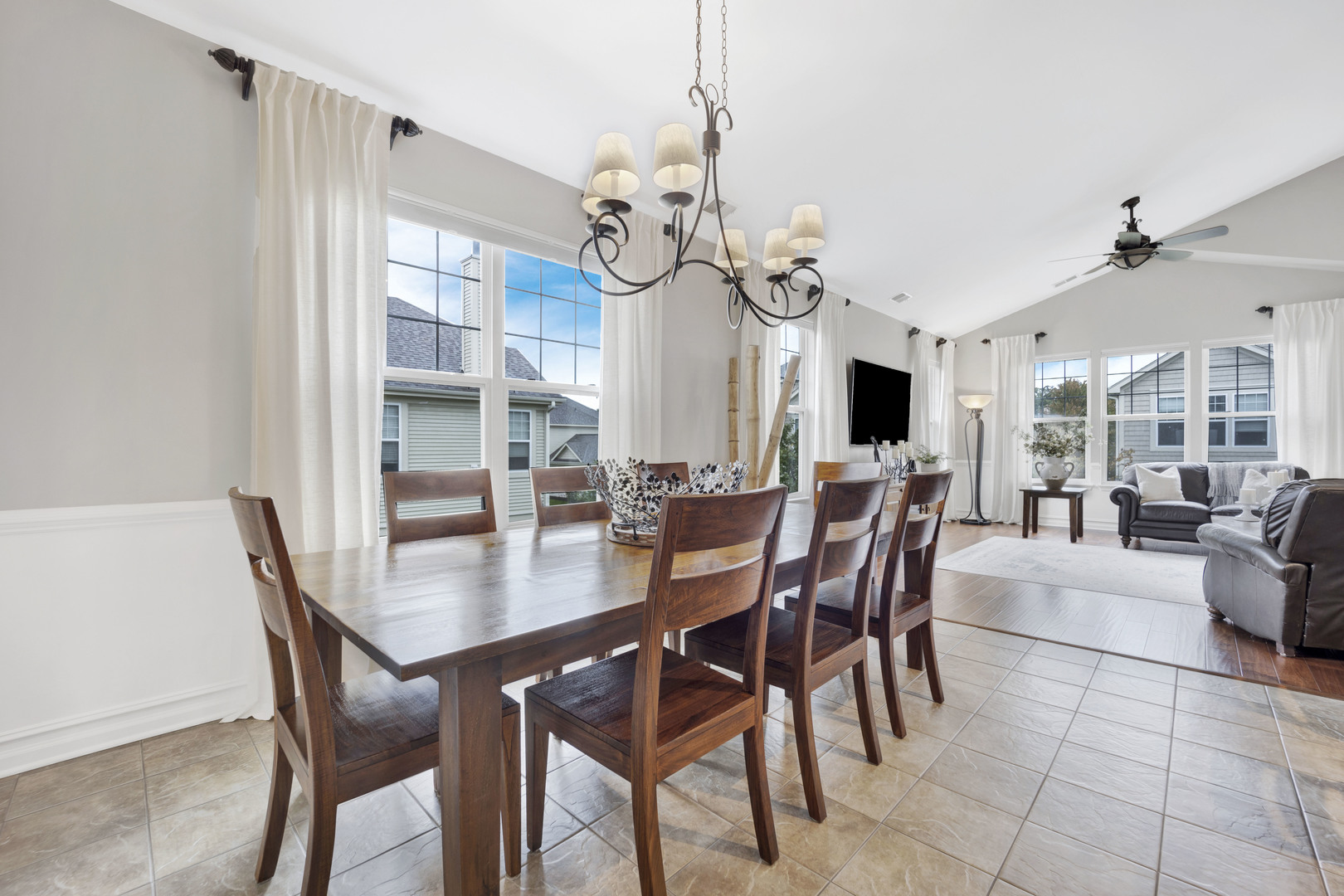 1914 Havenshire Road, Unit 1914 Aurora, IL 60502 - Photo 7 of 31 a view of a dining room with furniture and a chandelier