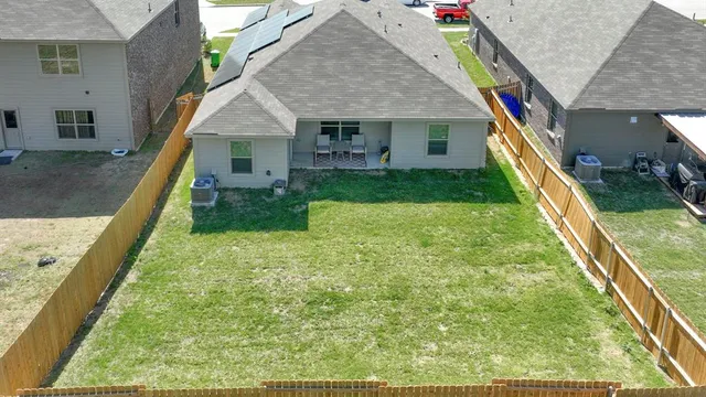 a aerial view of house with yard