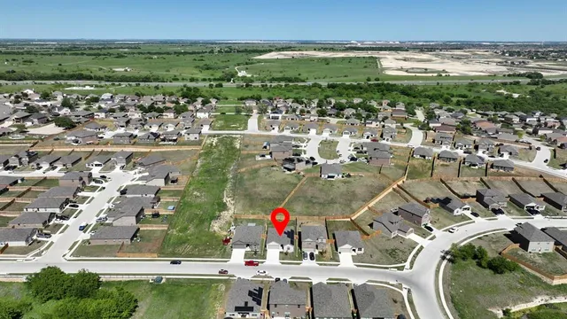 an aerial view of residential building and lake