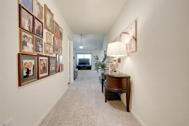 a dining room with furniture and a mirror