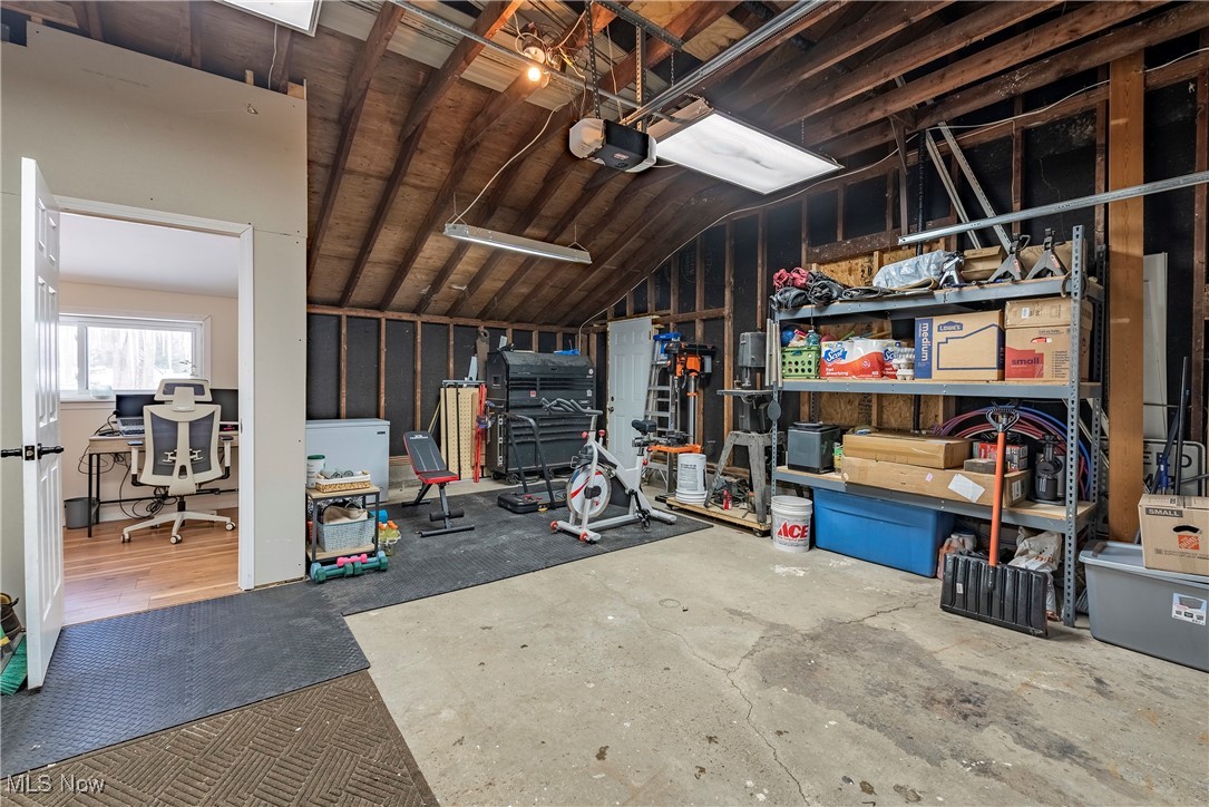 8767 Edgehill Road Mentor, OH 44060 - Photo 25 of 47 Garage featuring a garage door opener