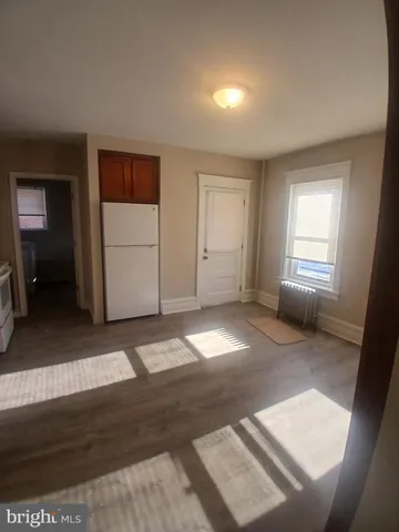 a view of hallway with stairs and furniture