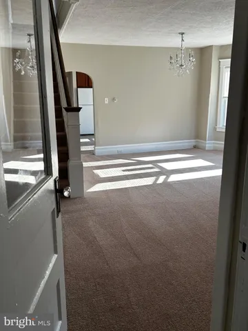 a view of a livingroom with a staircase