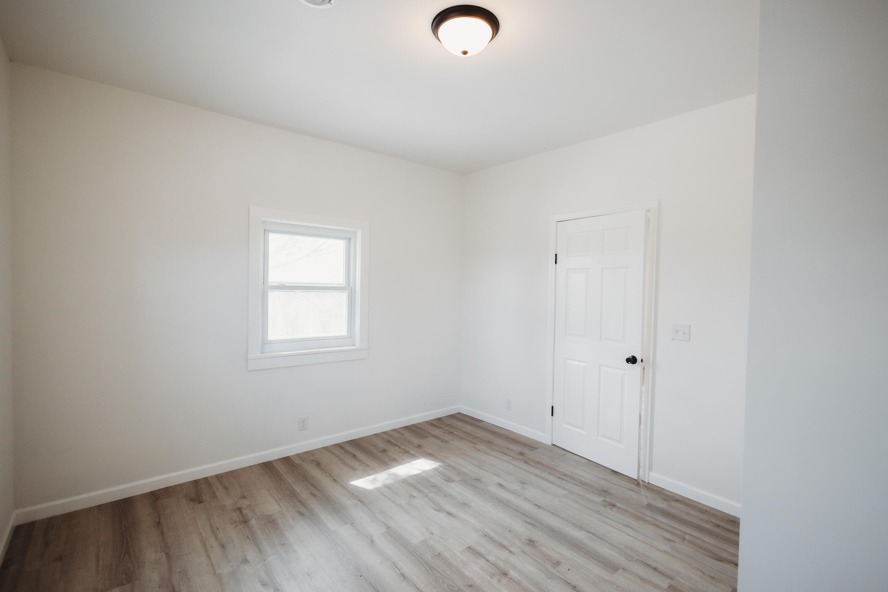 4812 East Bootjack Road Rolling Prairie, IN 46371 - Photo 11 of 13 a view of a room that has wooden floor cabinets and a window
