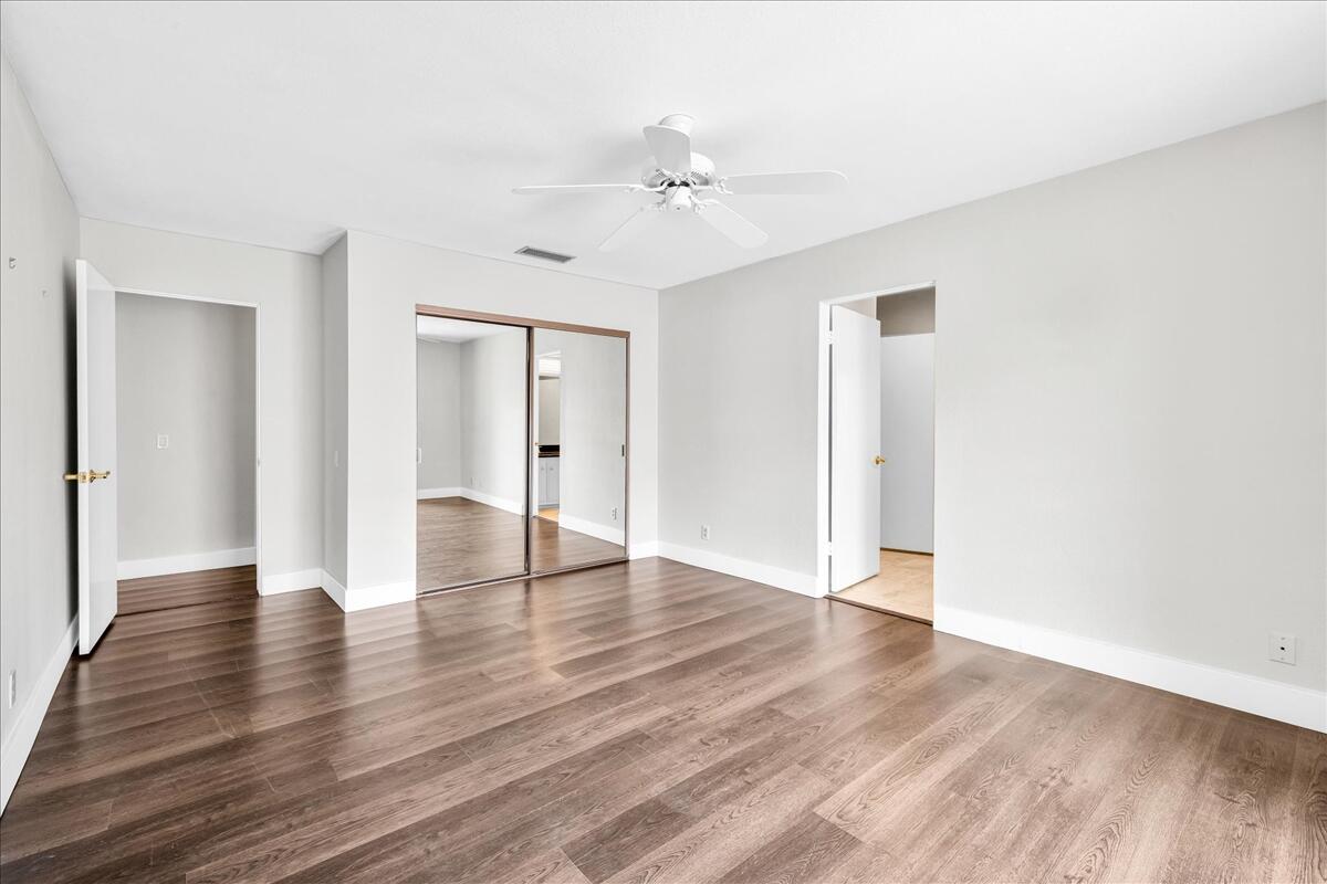 45 Lincoln Place Rancho Mirage, CA 92270 - Photo 24 of 59 a view of an empty room with wooden floor