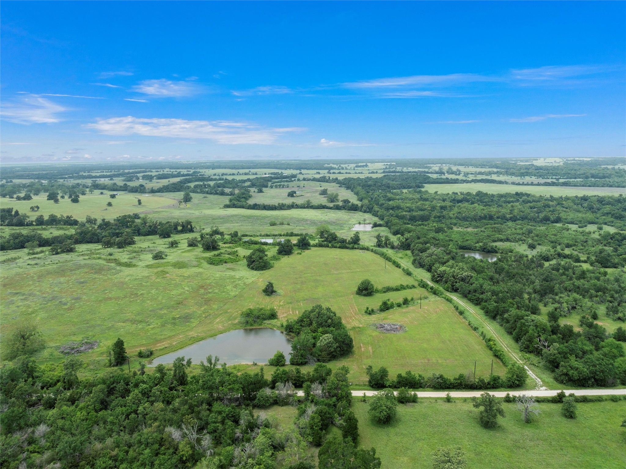 707 Lcr 707 Kosse, TX 76653 - Photo 1 of 15 an aerial view of a houses with outdoor space and garden