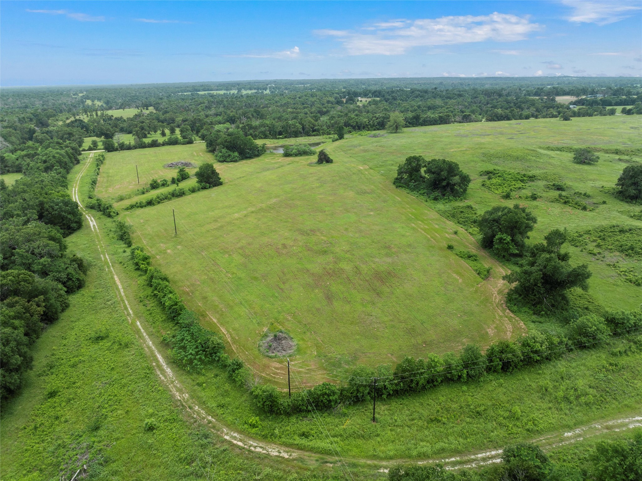 707 Lcr 707 Kosse, TX 76653 - Photo 14 of 15 a view of a lake with a yard