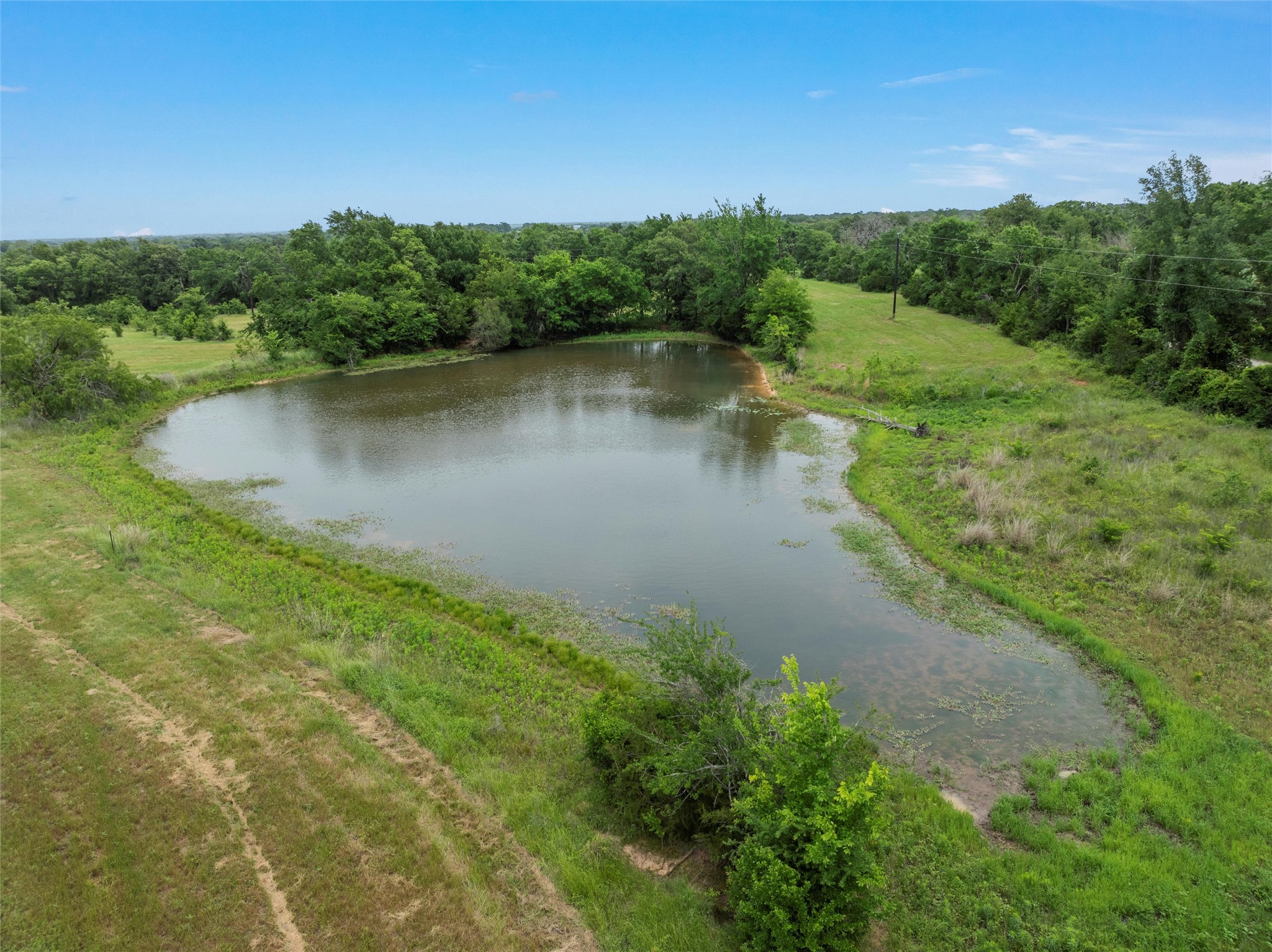 707 Lcr 707 Kosse, TX 76653 - Photo 4 of 15 a view of a lake with houses in background