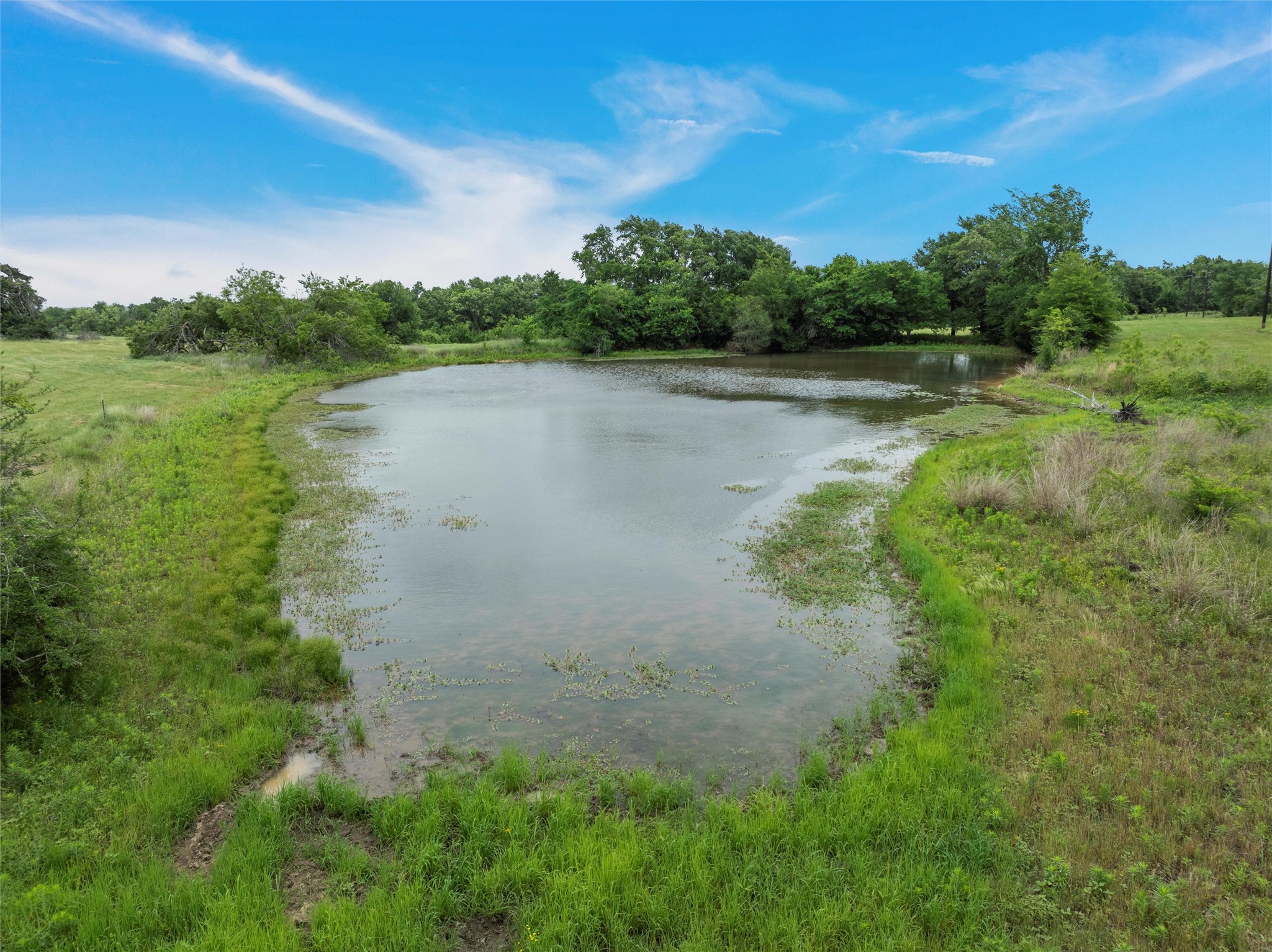 707 Lcr 707 Kosse, TX 76653 - Photo 5 of 15 a view of a lake with a big yard