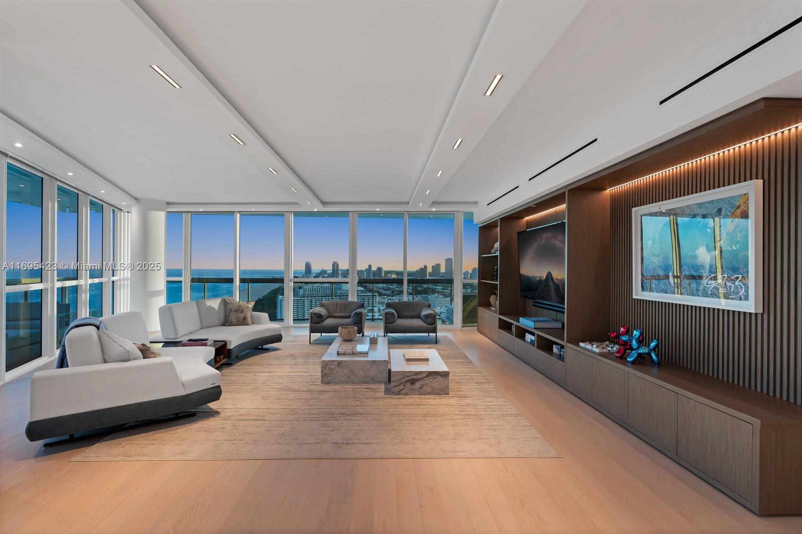 101 20th Street, Unit 3503/06/09 Miami Beach, FL 33139 - Photo 1 of 57 a living room with furniture and a flat screen tv